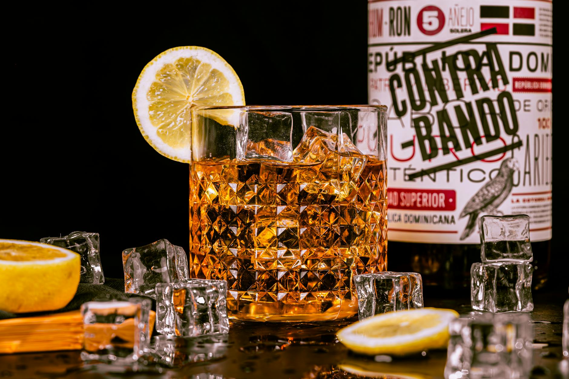 Whisky Served in Glass with Lemon and Ice