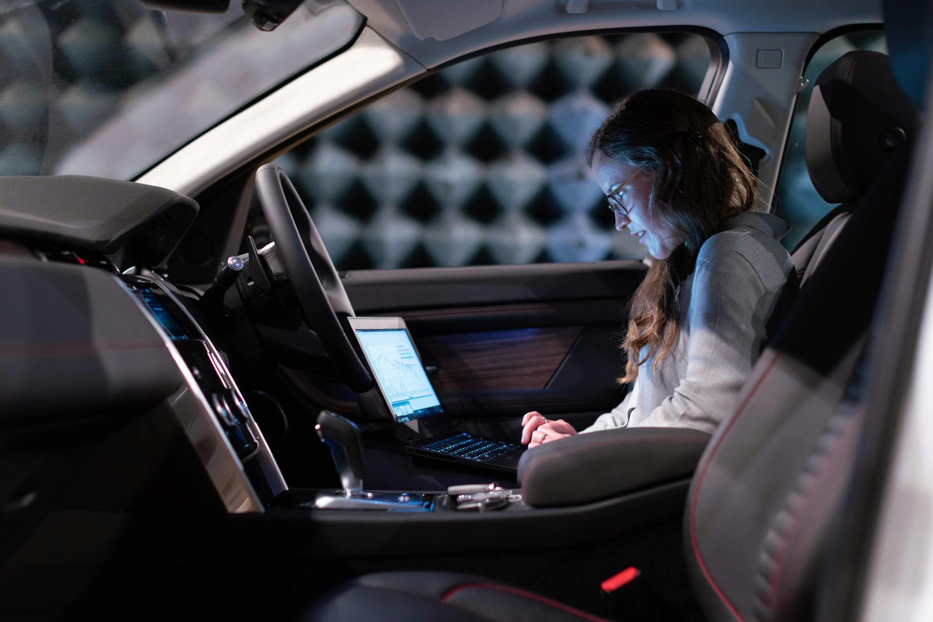 Engineer using Laptop in car