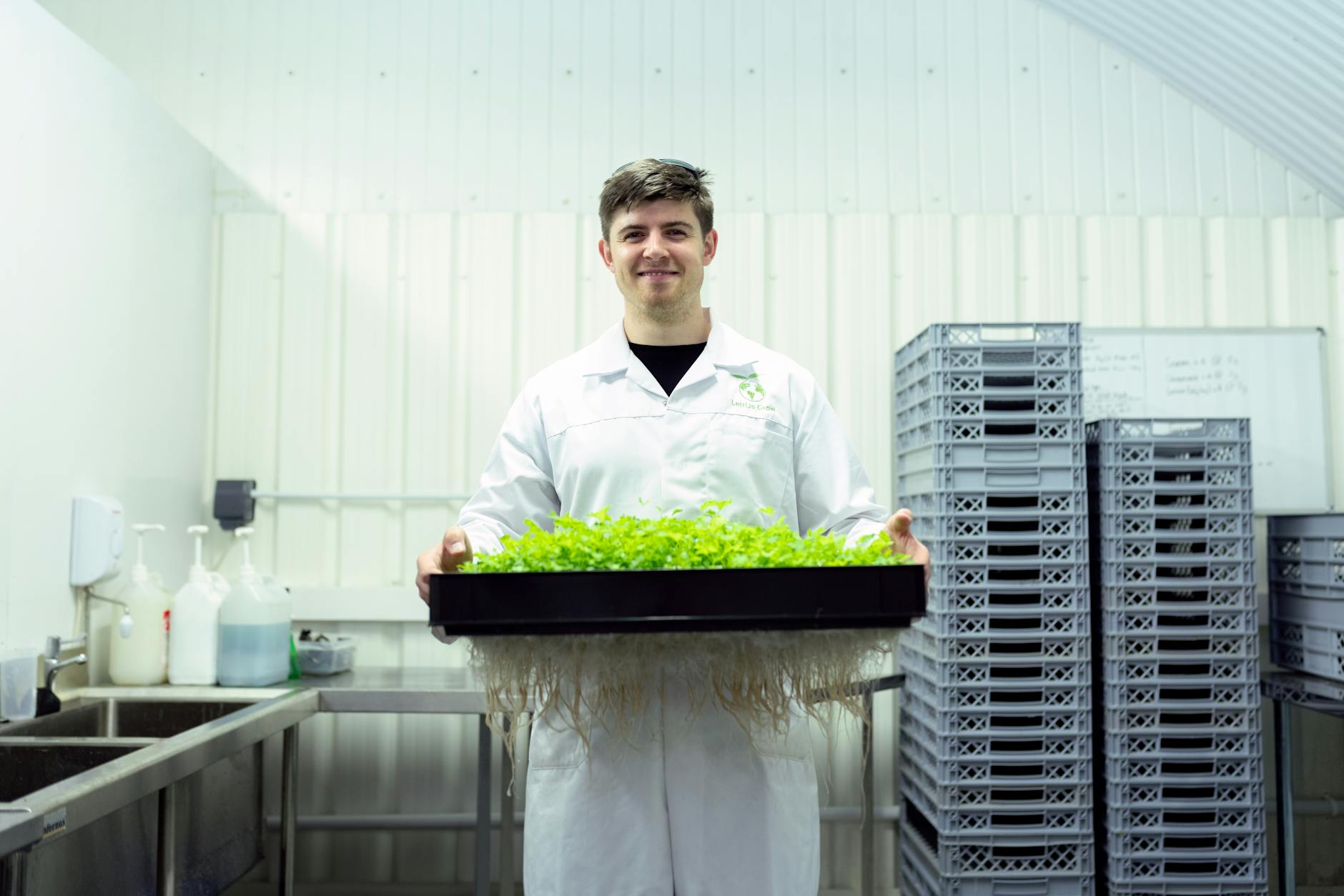 Scientist Holding Crops in Laboratory