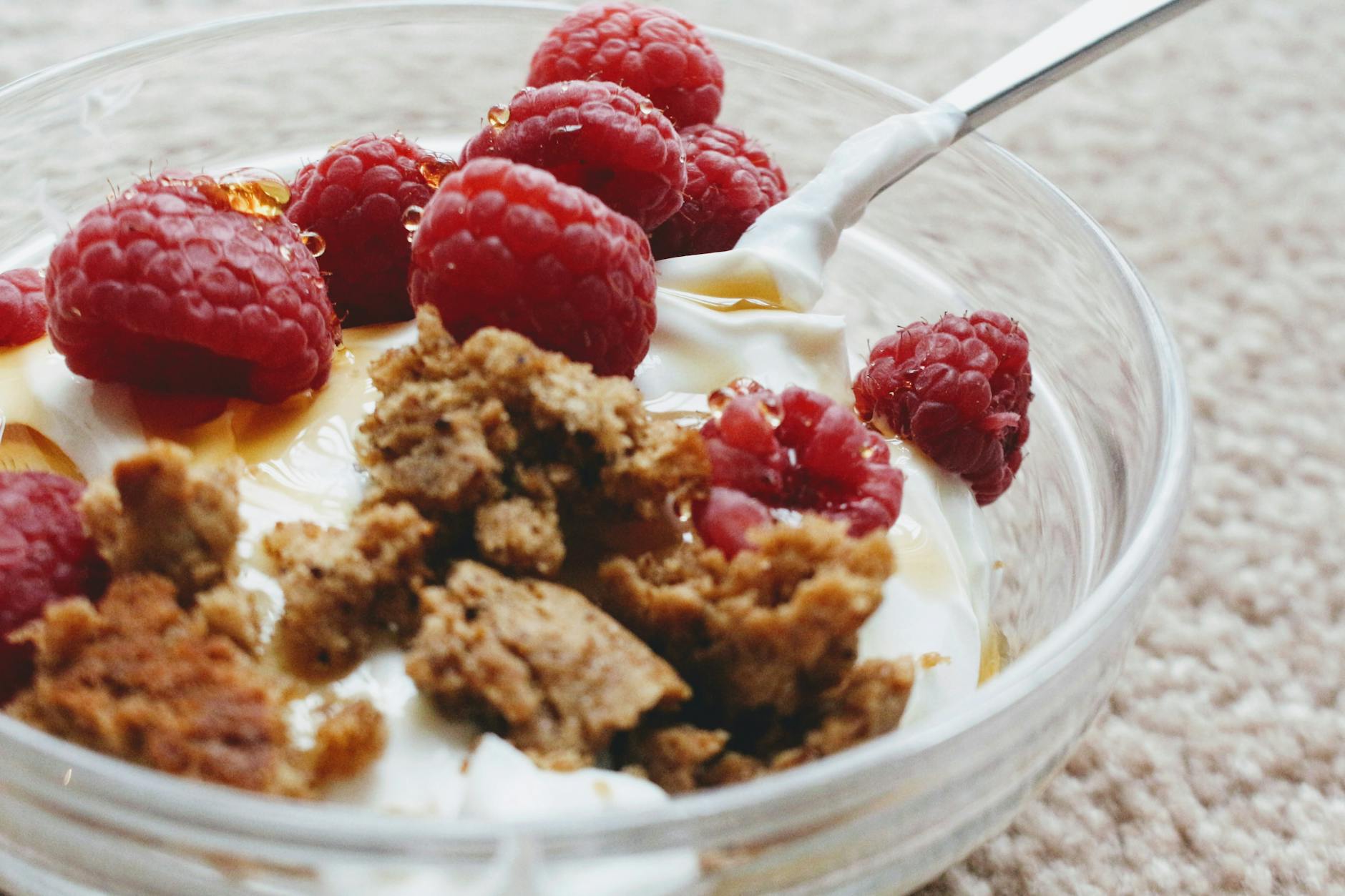 Delicious Greek yogurt with biscuit crumb and fresh raspberries