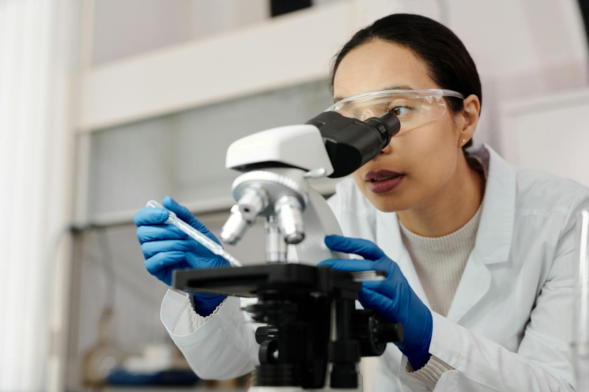 Woman Using a Microscope