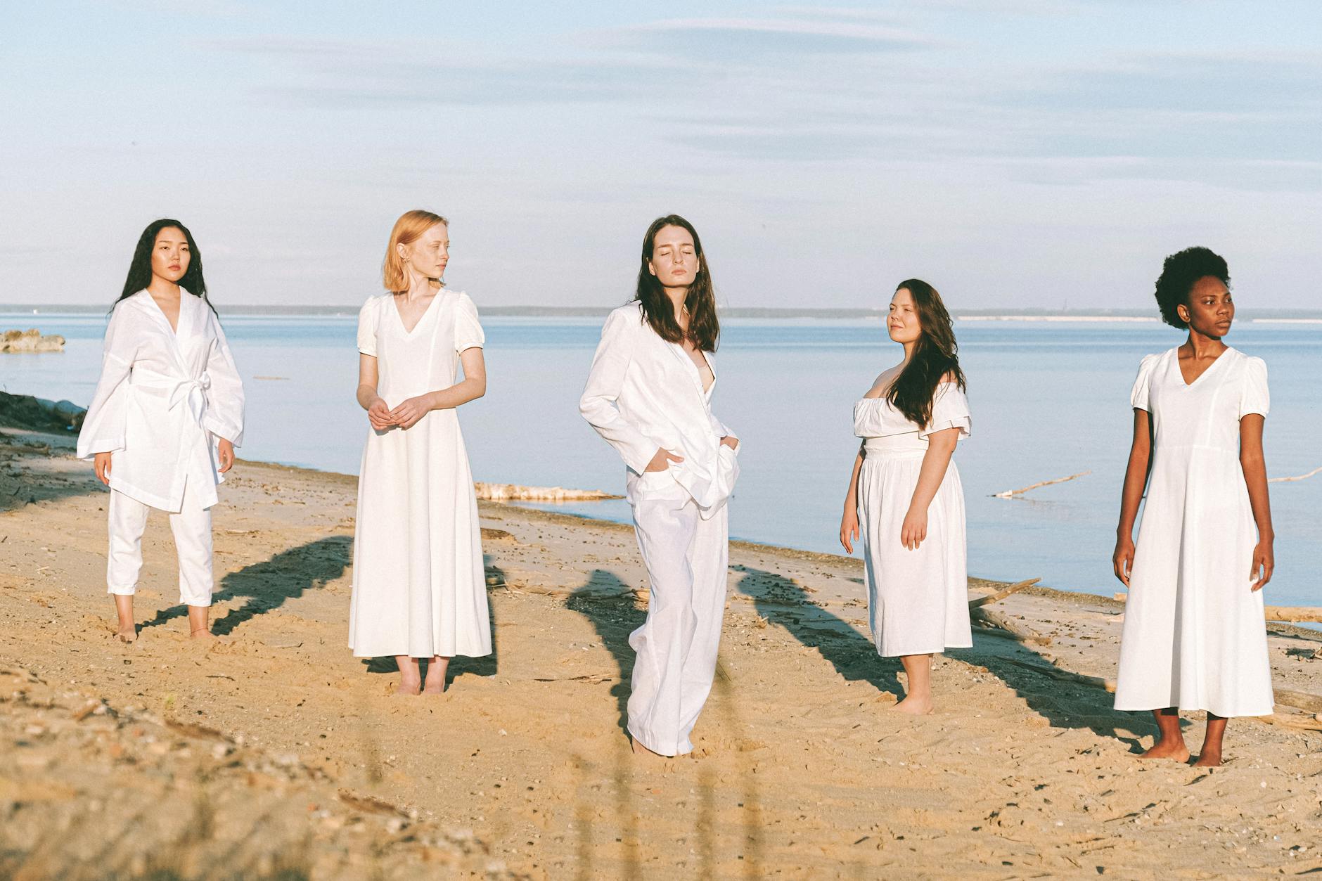 Photo of Women Standing Beside Sea