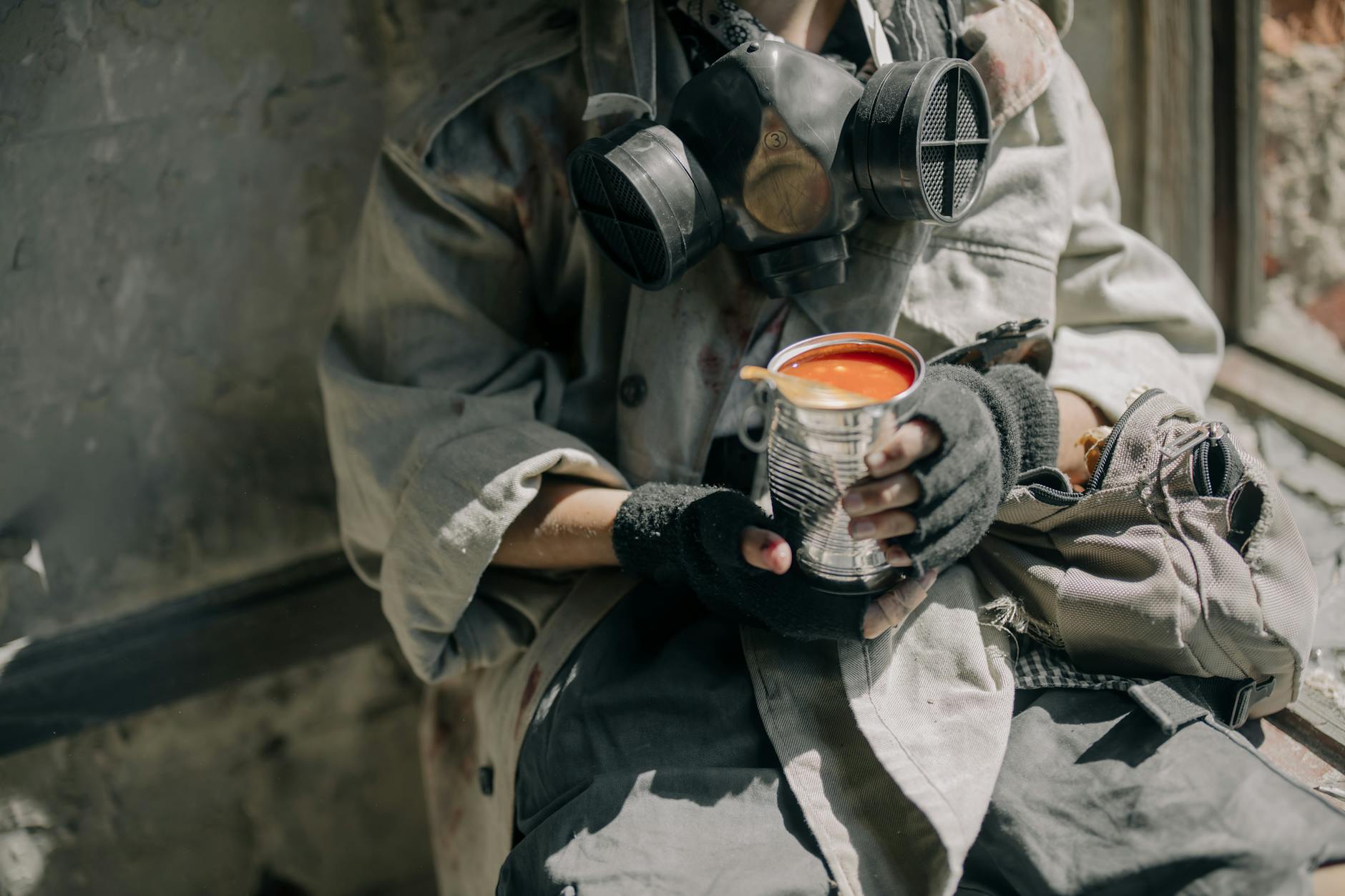 Person in Gray Jacket Holding White and Red Ceramic Mug