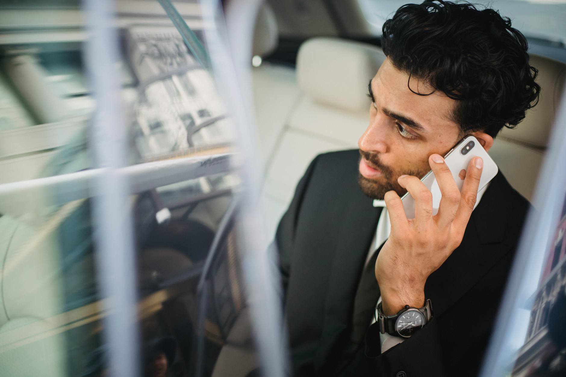 Man in Black Suit Jacket Holding Smartphone