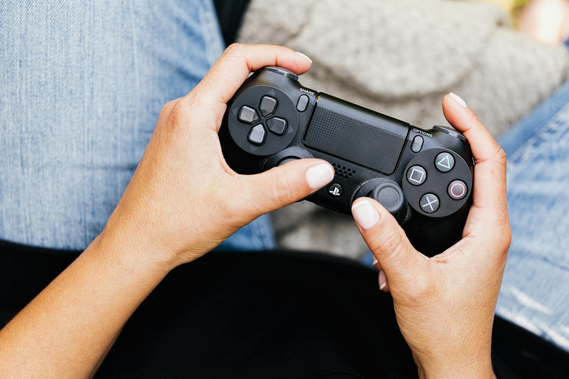 A Close-Up Shot of a Person Using a Video Game Controller