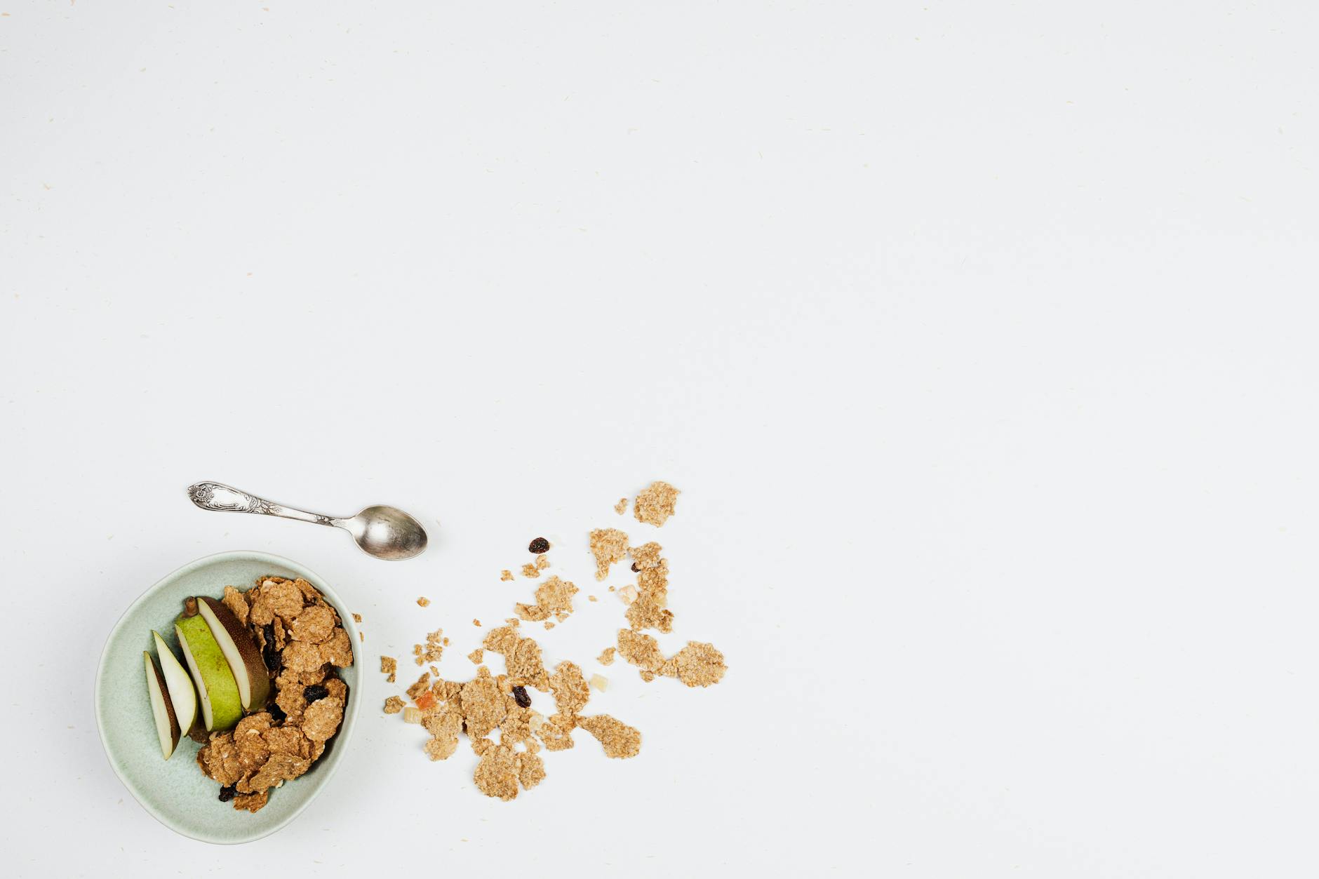 Fresh Fruits and Cereals in a Bowl on a White Surface