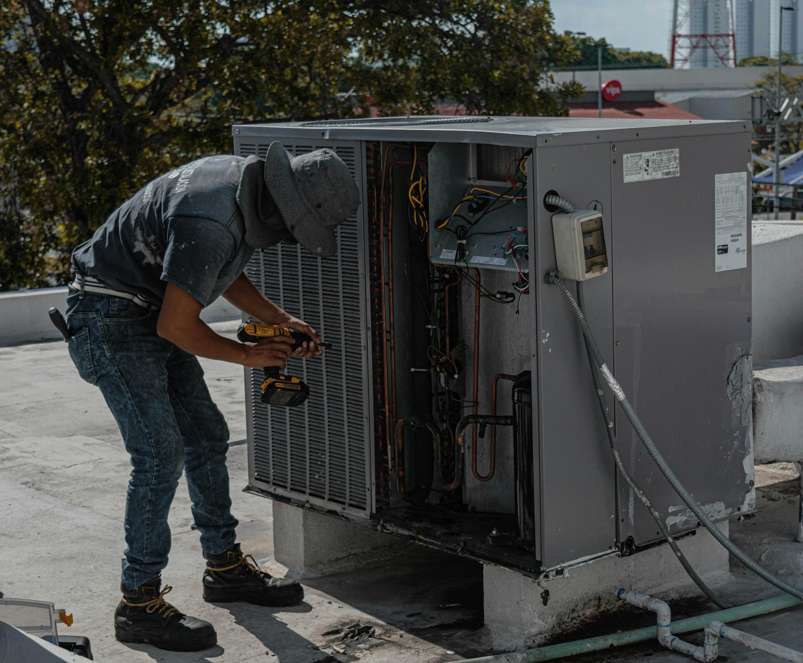 Repairman Repairing an Air Conditioner