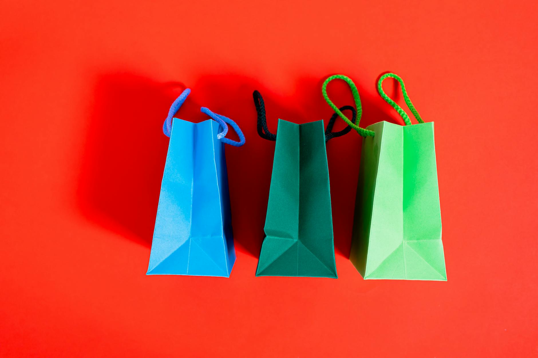 Shopping Bags On A Red Surface