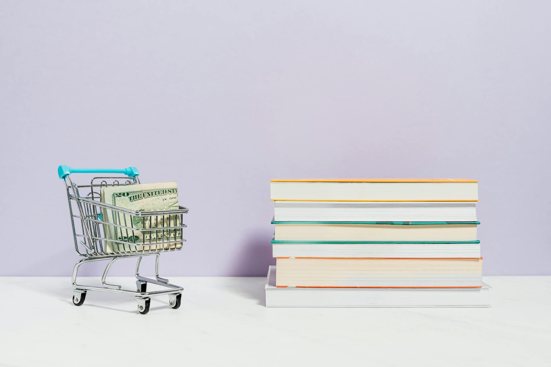 Stack of Books Beside a Shopping Cart