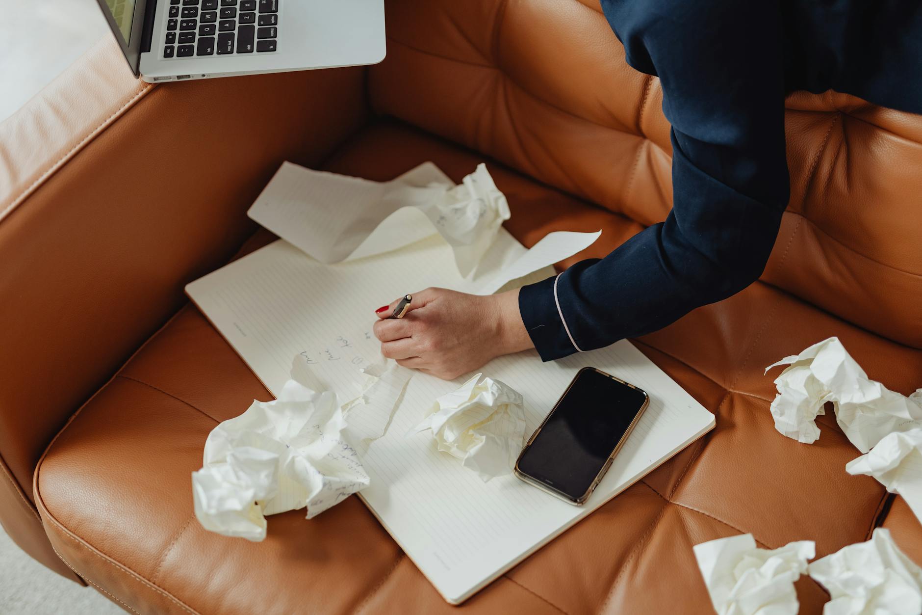 Person Writing on a Paper