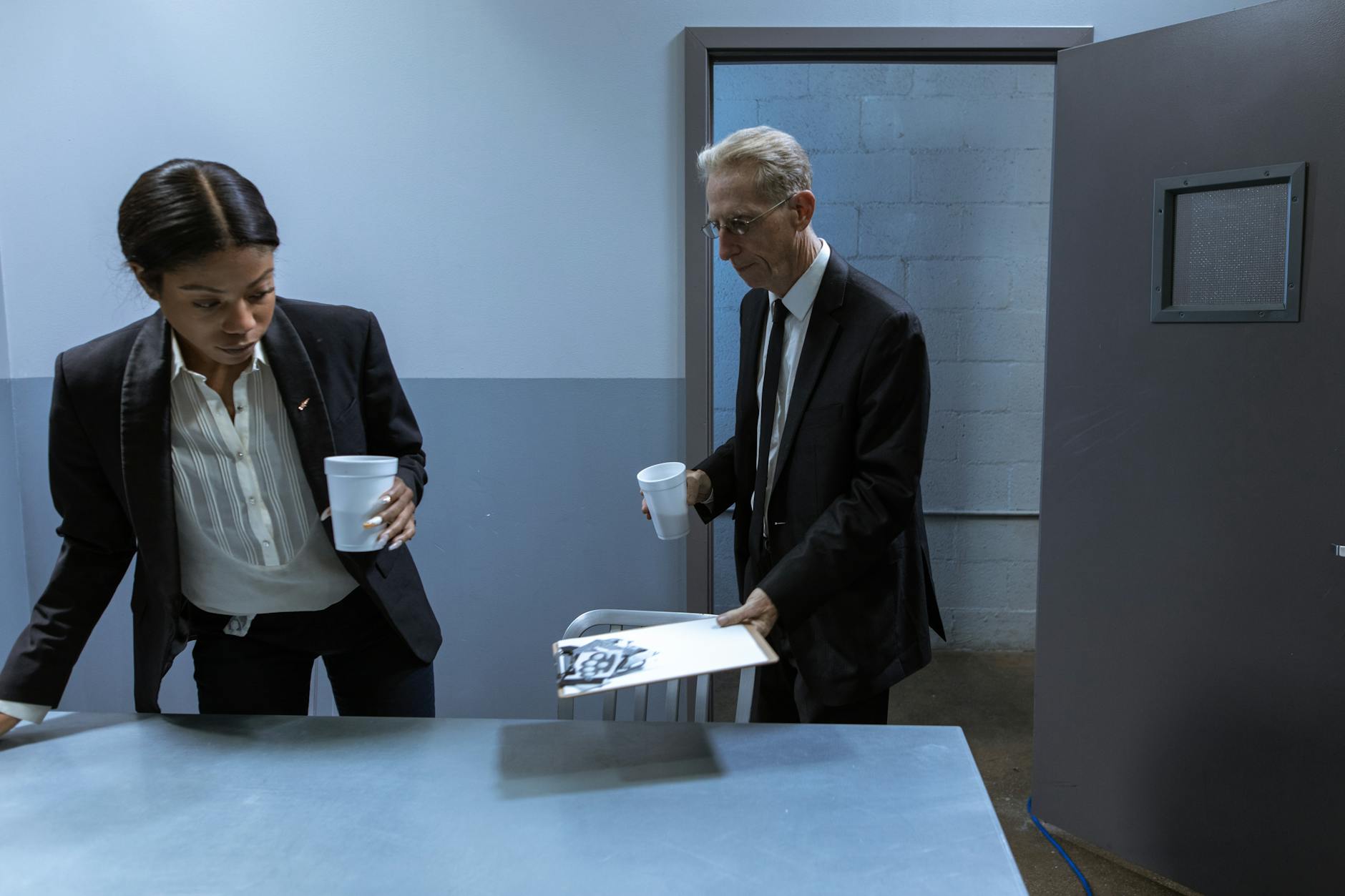 Man in Black Suit Jacket Standing Beside Man in Black Suit