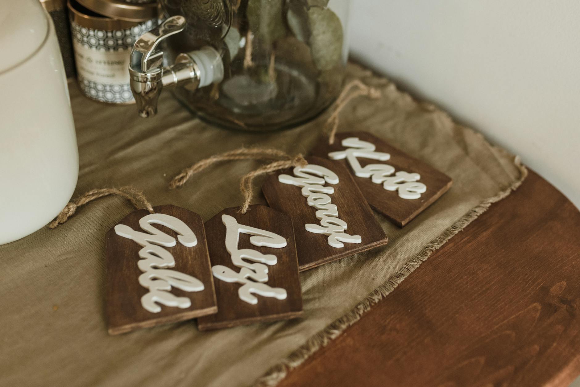 Wooden Name Tags on the Brown Fabric