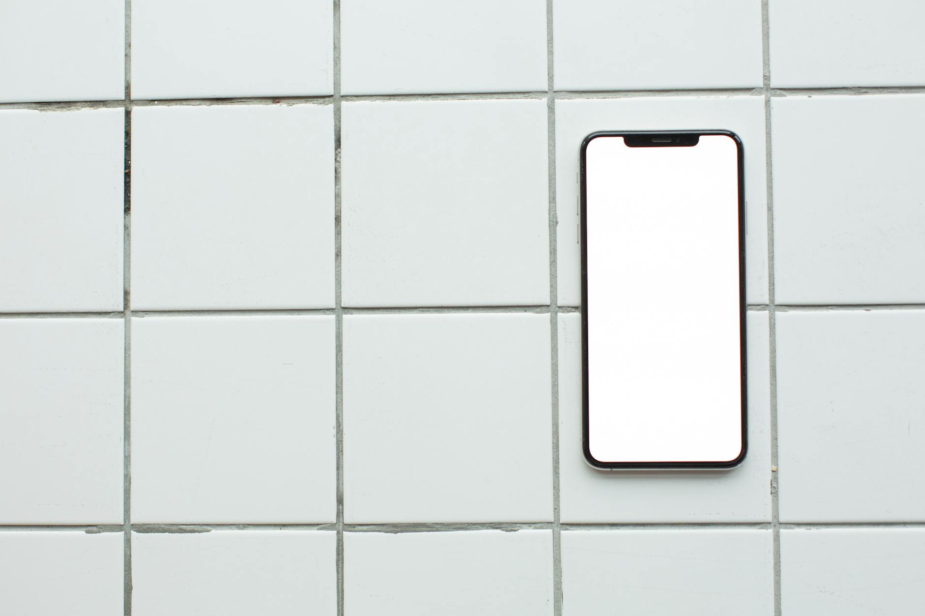 A Smartphone with Blank Screen Lying on Tiled Surface