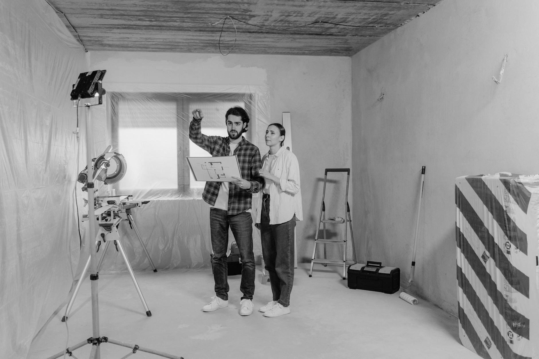 A Couple Discussing Their Home Under Construction