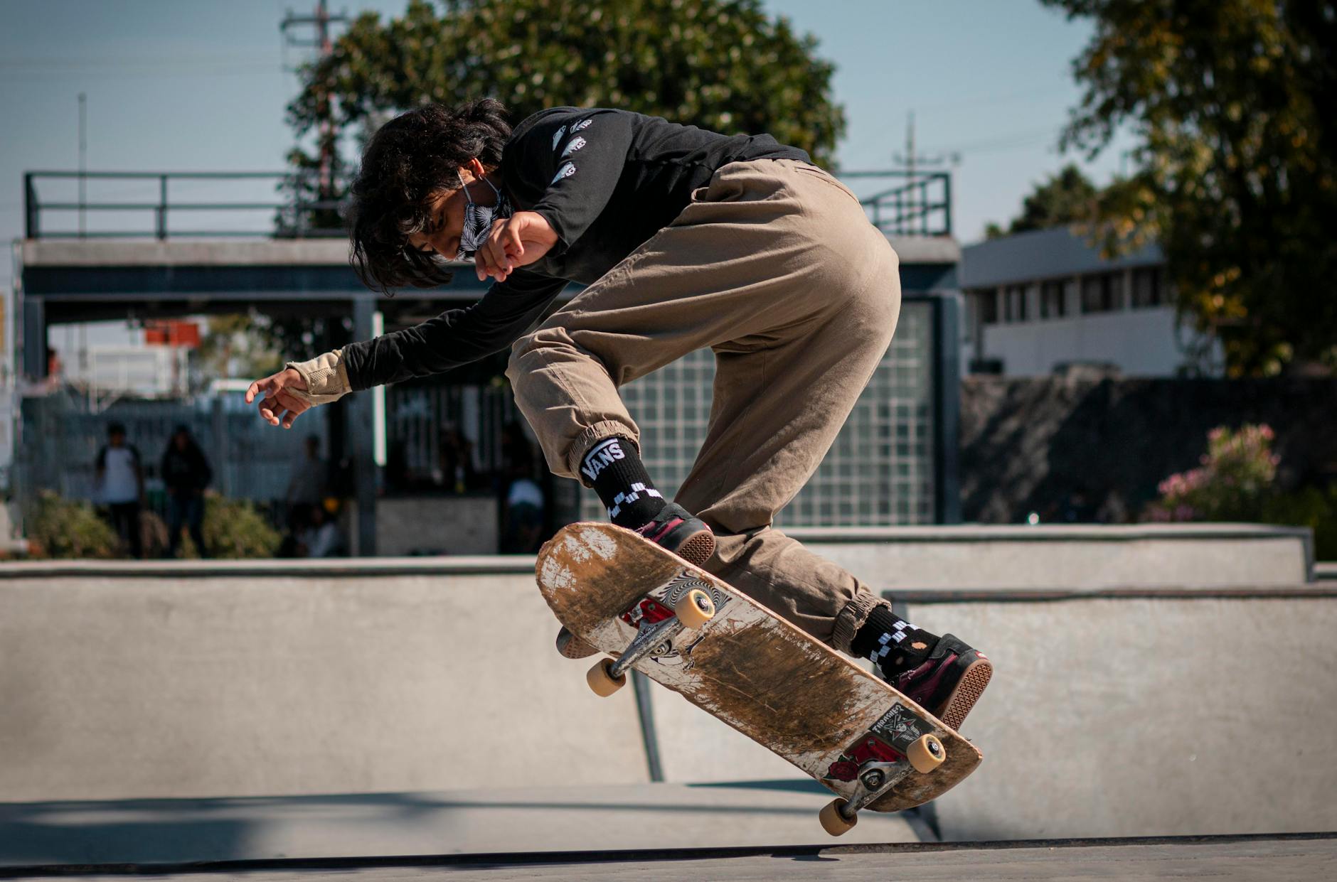 Skater Wearing a Face Mask Doing a Trick