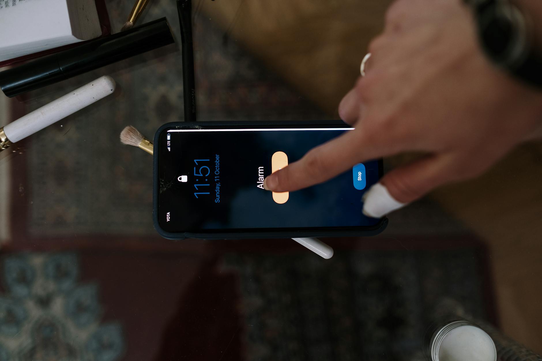 Hand Touching a Touchscreen of a Smartphone