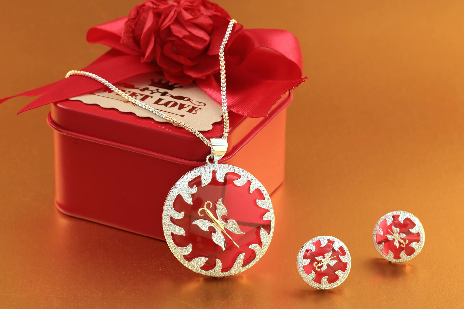 Close-up Photo of Red Gift Box with Jewelries