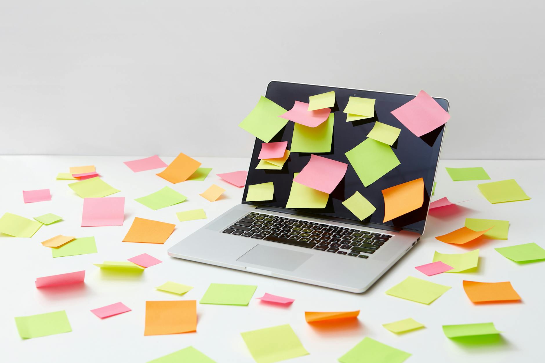 A Laptop with Multicolor Sticky Notes