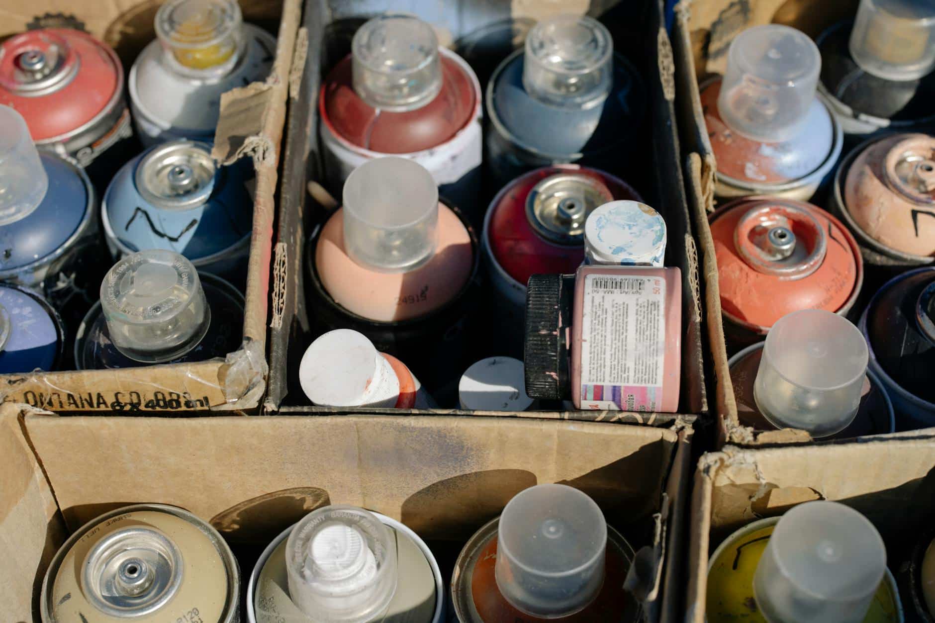 Close-Up Shot of a Spray Paint in a Box