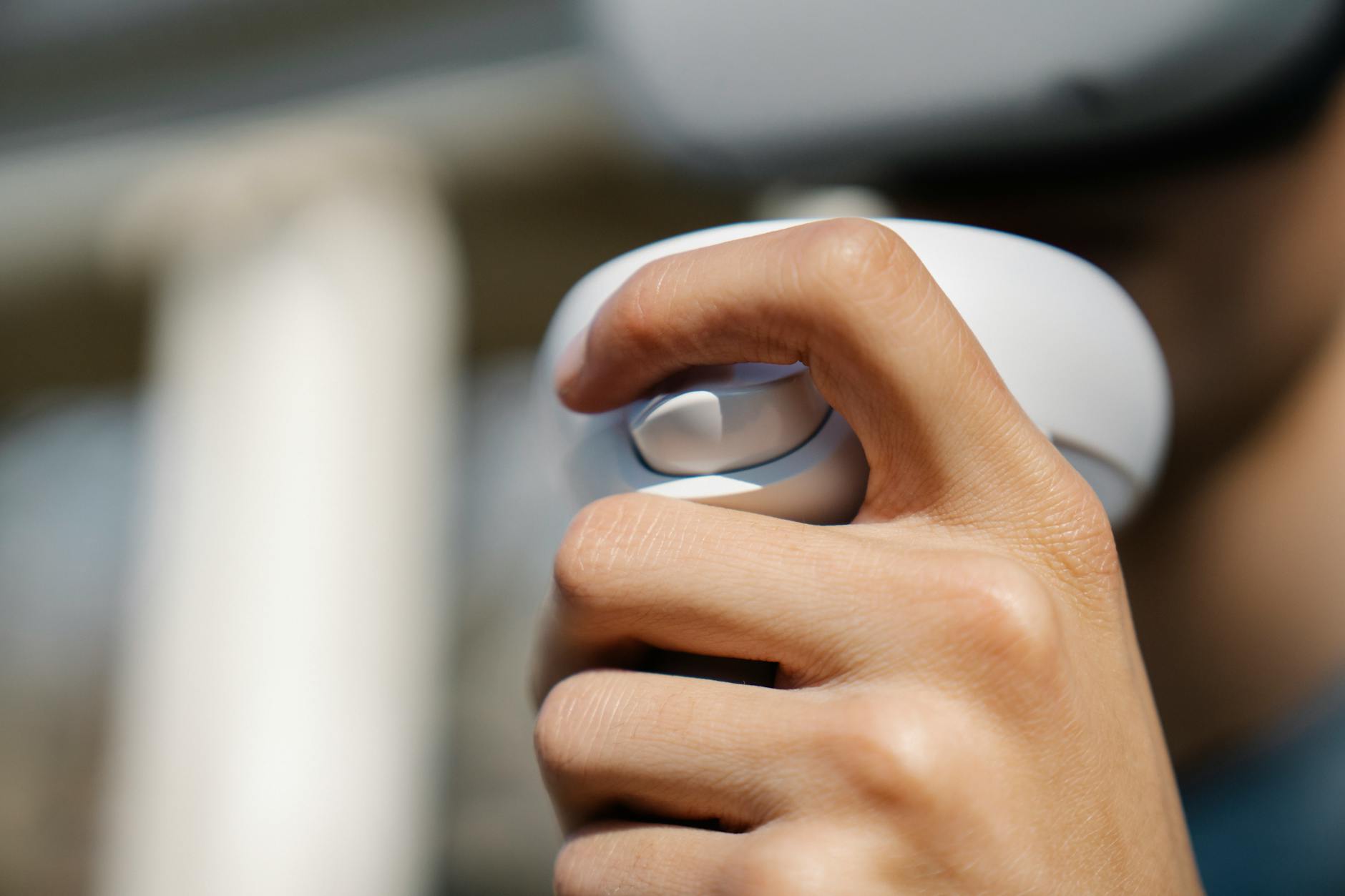 Crop person holding modern wireless controller