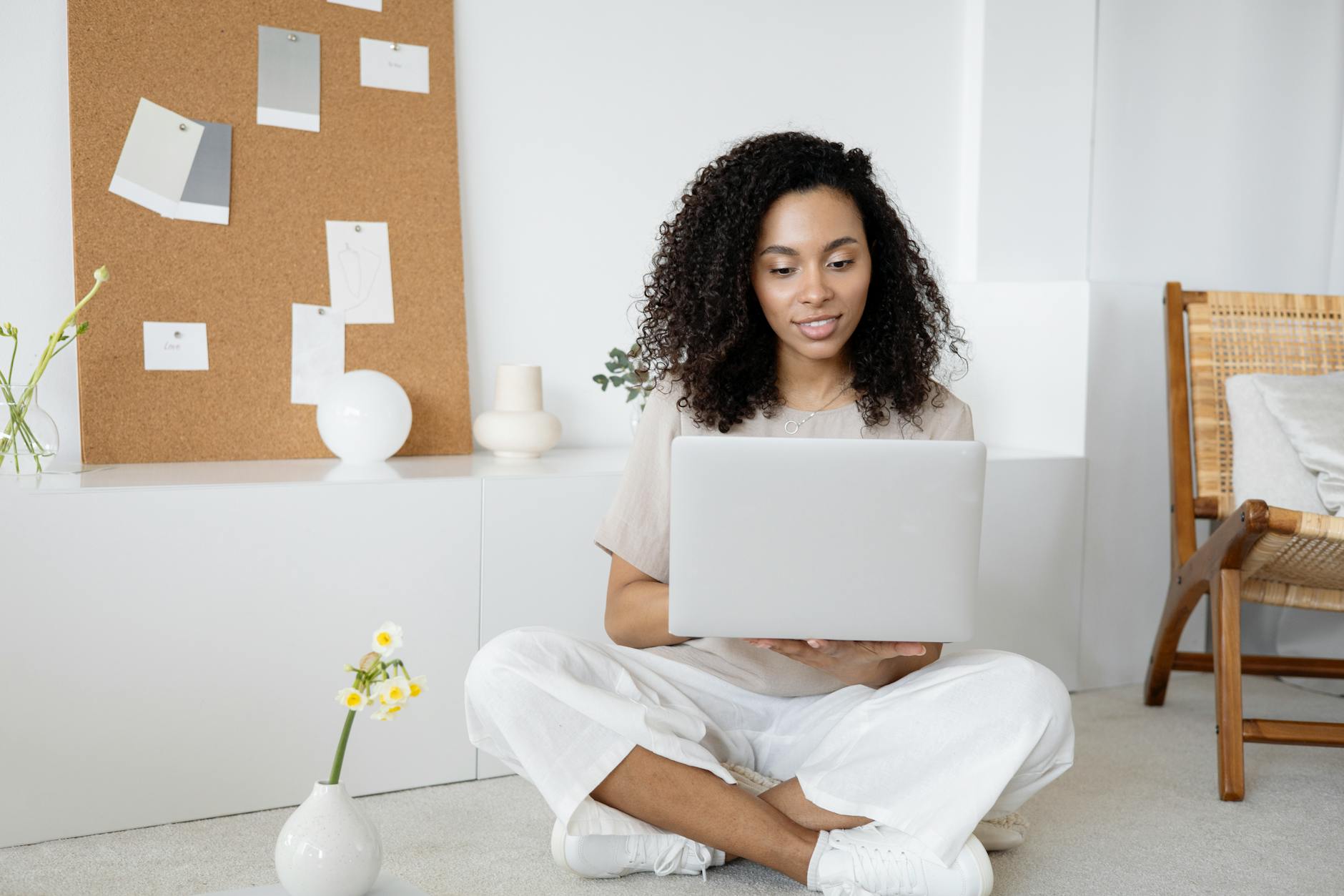 woman sitting using a laptop