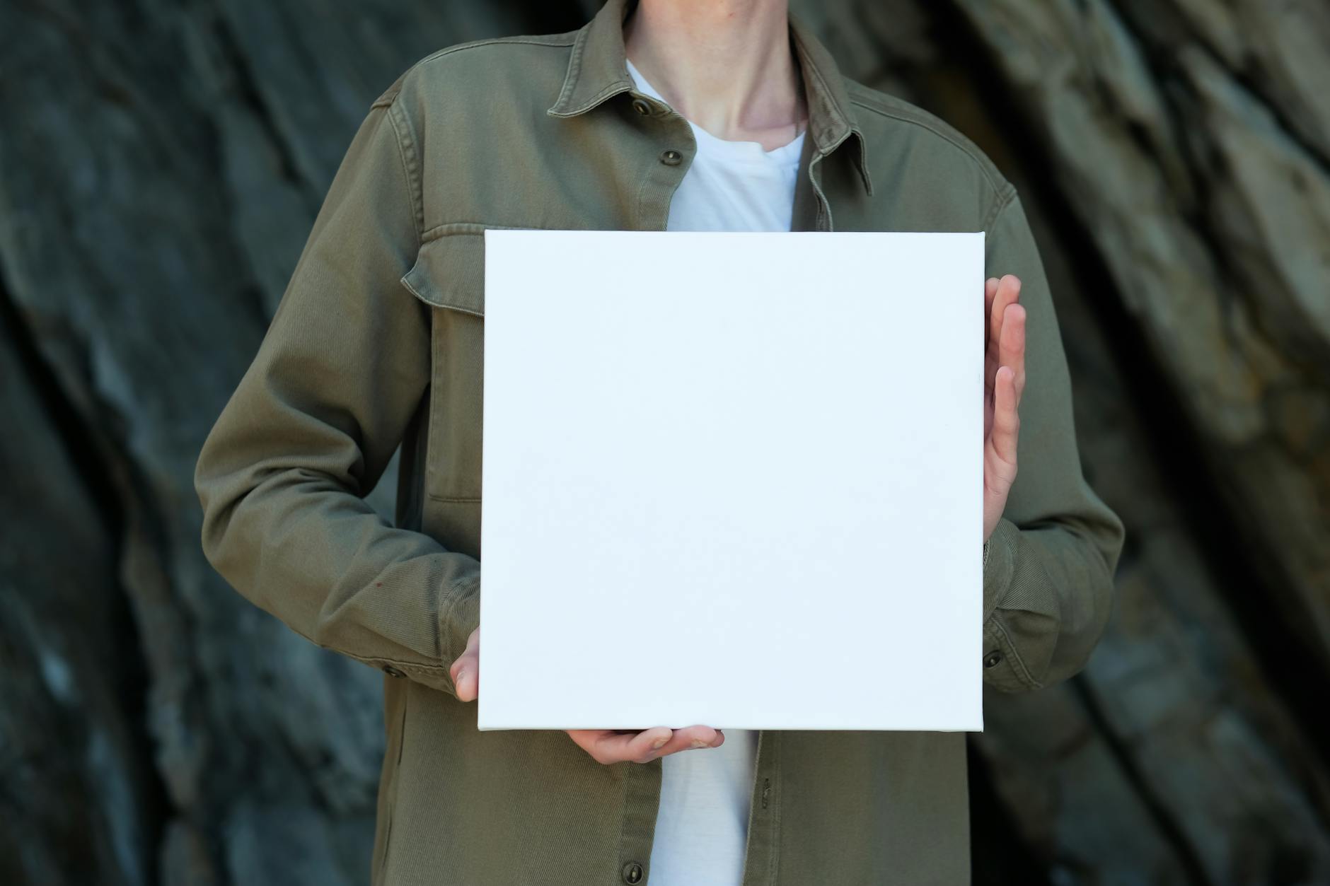 A Person Holding White Blank Paper