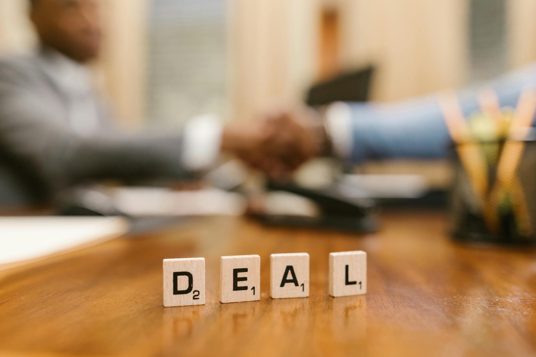 Close-Up Shot of Scrabble Tiles on a Table