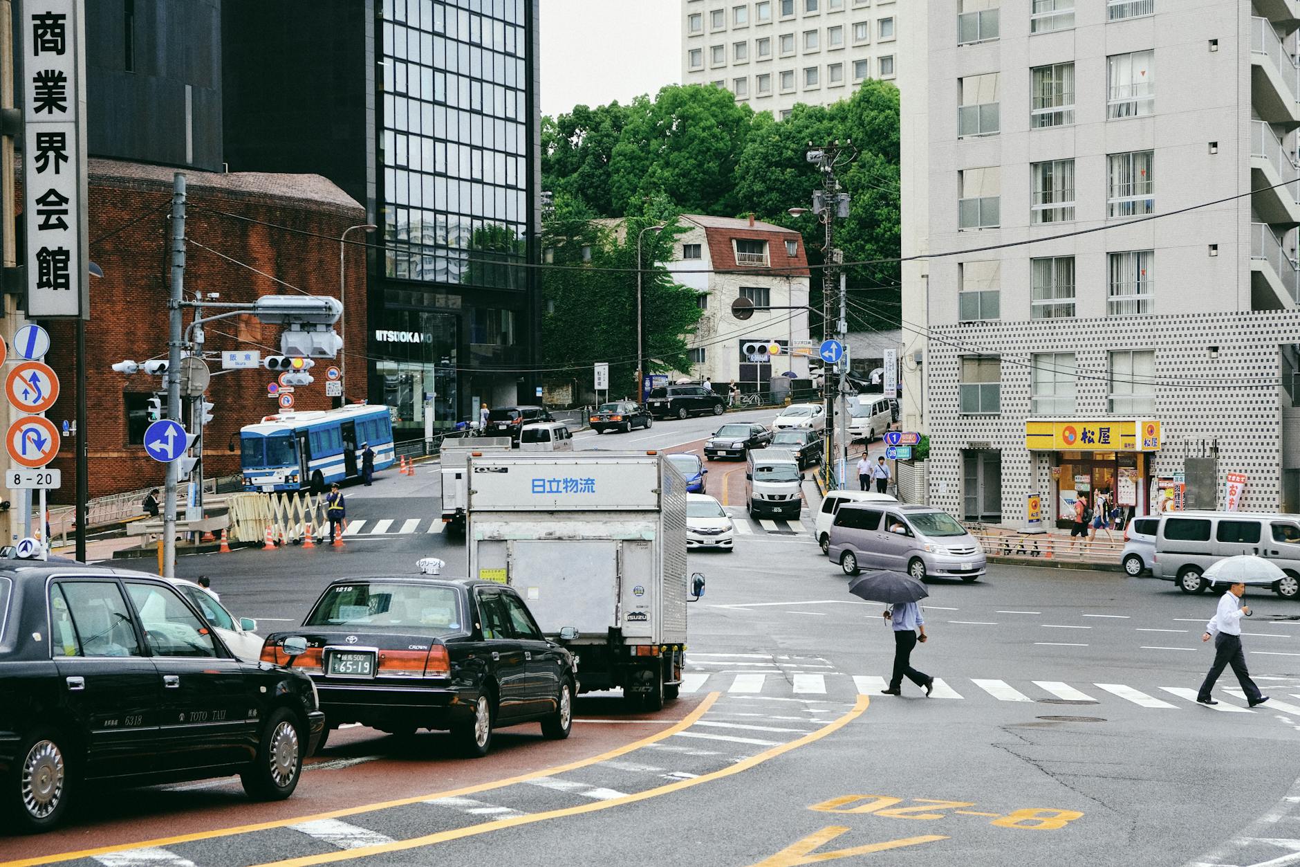 Cars Driving Road in Asian City