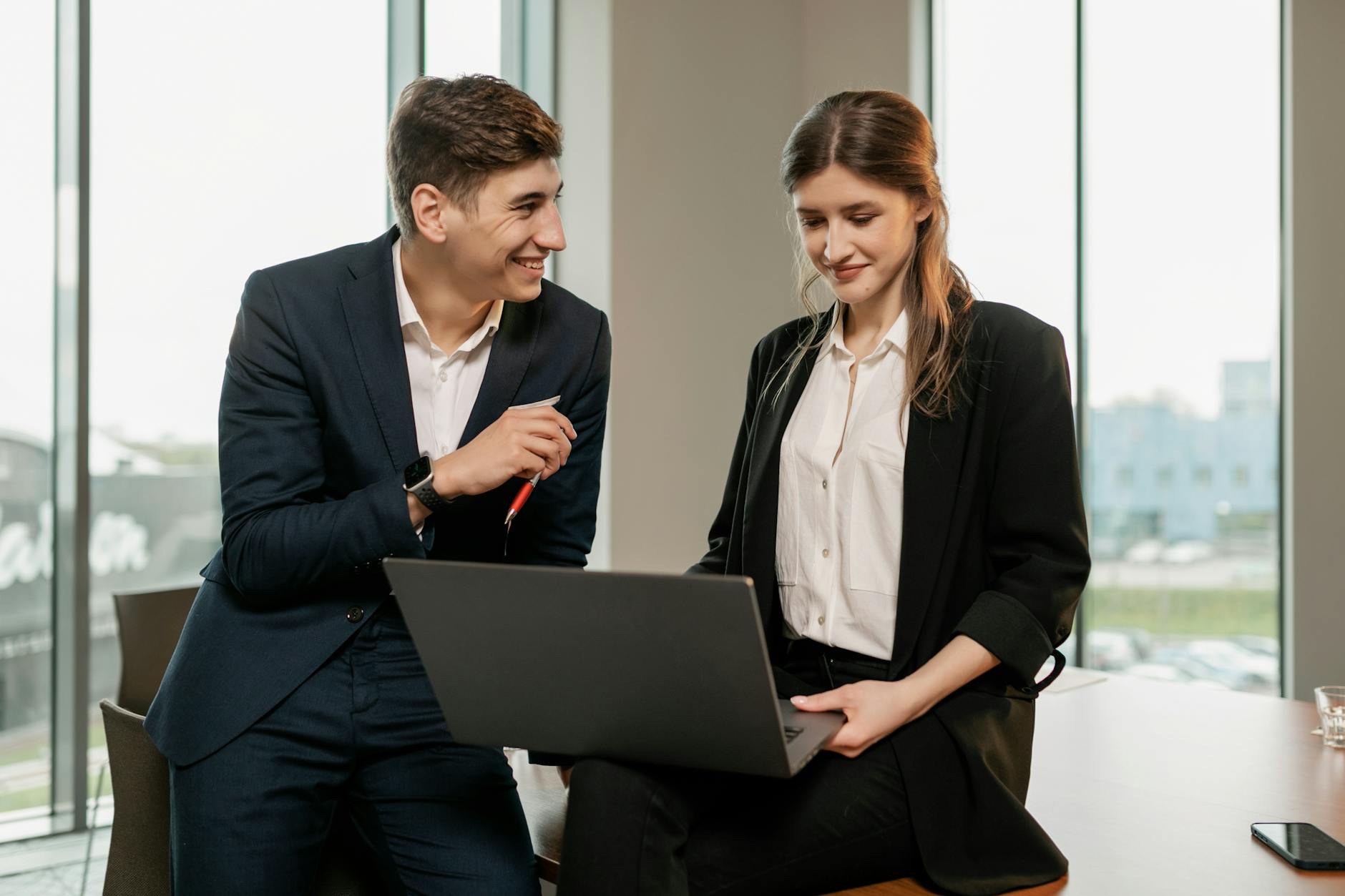 A Man and Woman using Laptop Together