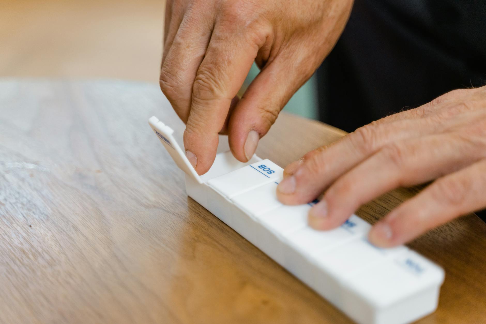 Person Holding White Rectangular Box