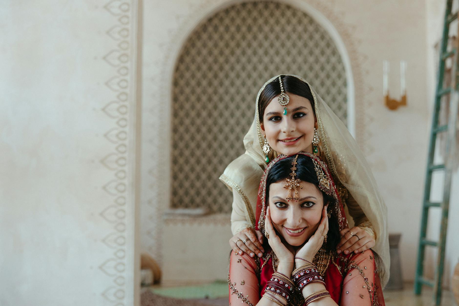 Smiling Women in Traditional Indian Sari and Accessories