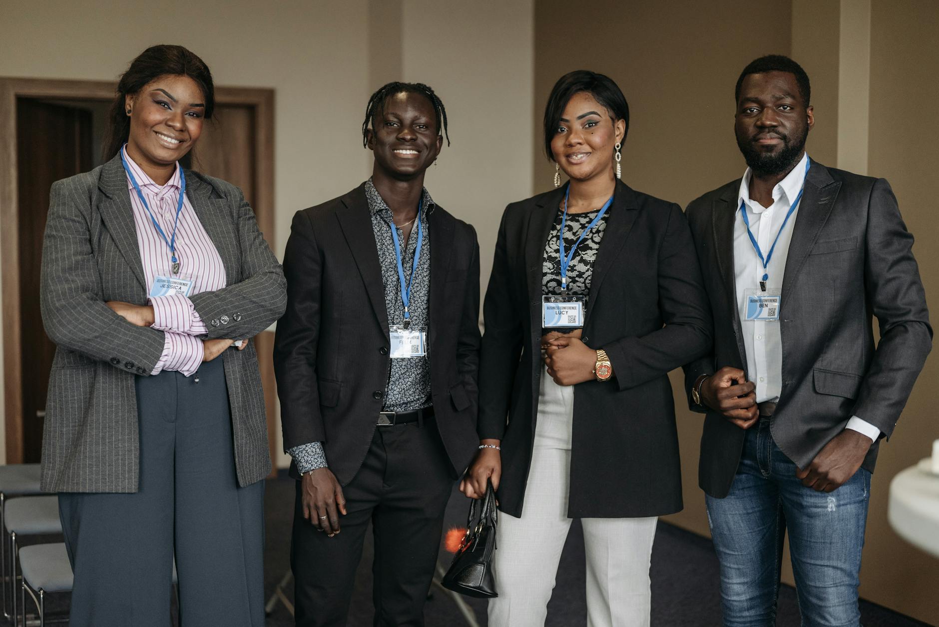 Group of People Wearing Corporate Attire and Badge Smiling