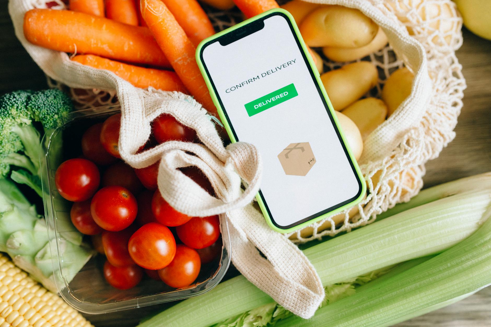 Close-Up Photo of a Vegetables and Mobile Phone