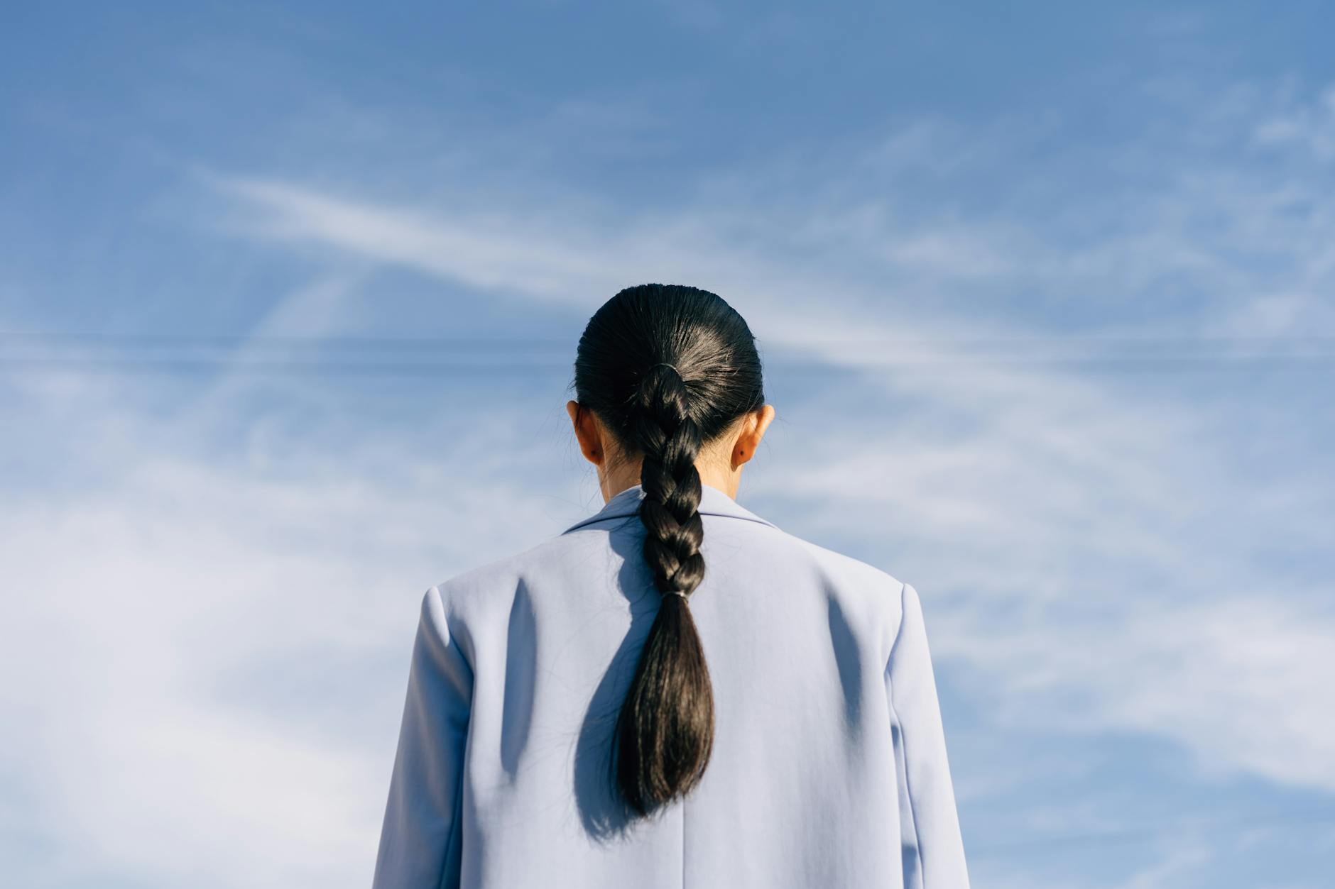 Back View of a Person Wearing a Light Blue Blazer