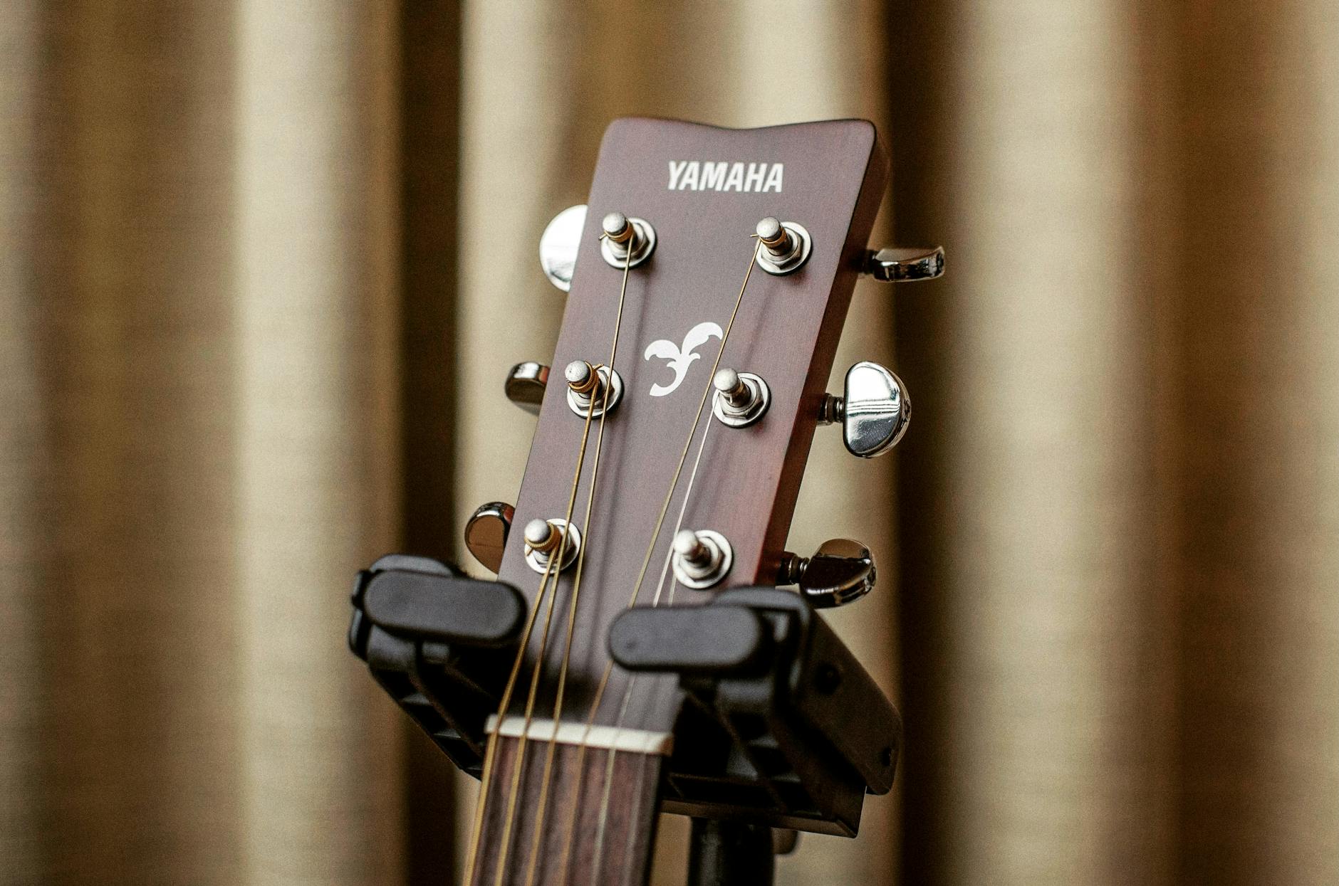 Close Up Photography of a Yamaha Acoustic Guitar