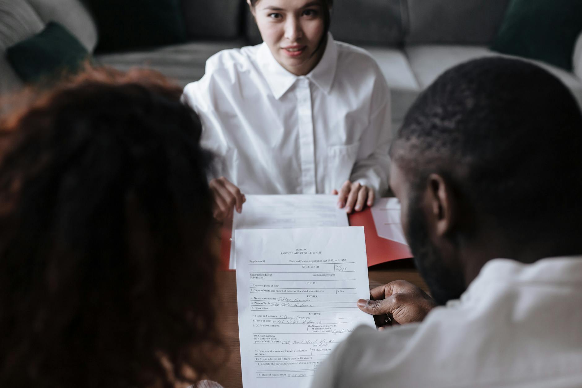 Couple Looking at Adoption Documents