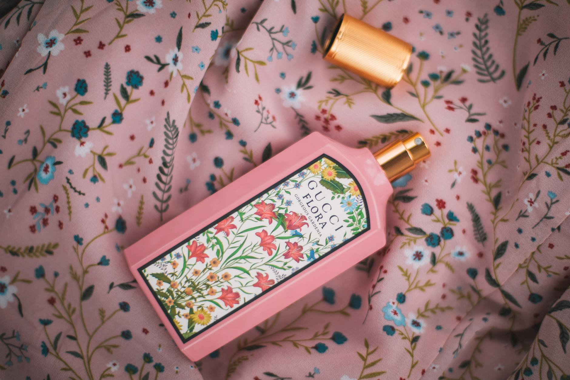 Open Perfume on Pink Linen