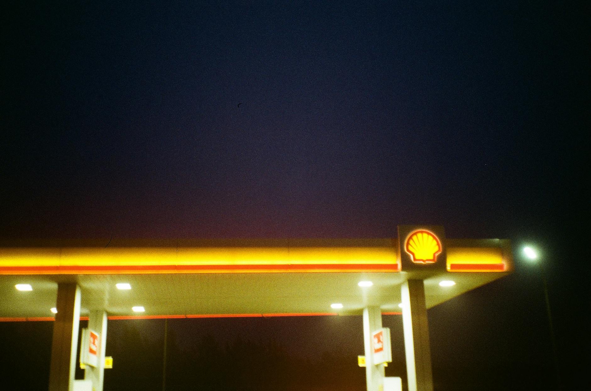 Illuminated Gas Station During Night Time