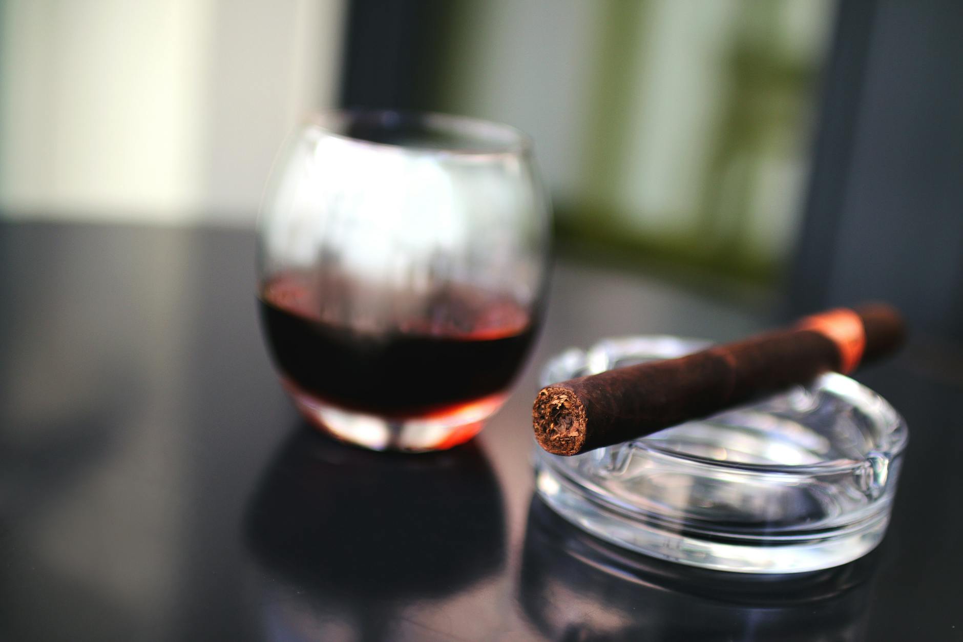 A group of friends enjoying cigars in a relaxed setting