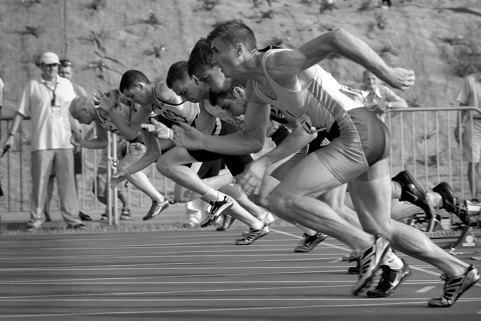 Athletes running on a track.